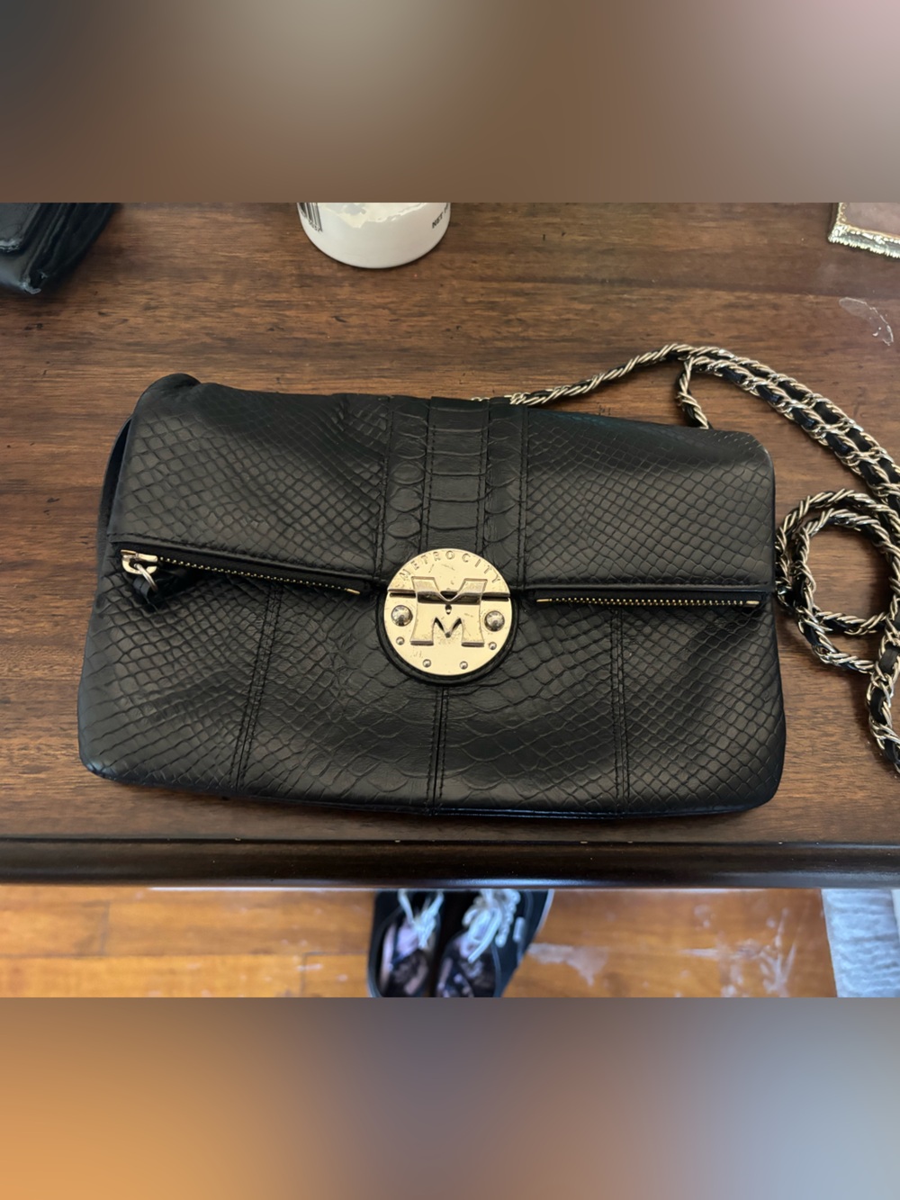 Black Quilted Crossbody Bag with Gold-Tone Medallion
